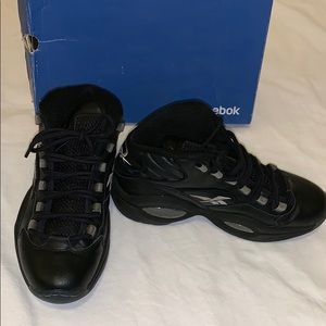 Black Reebok sneakers